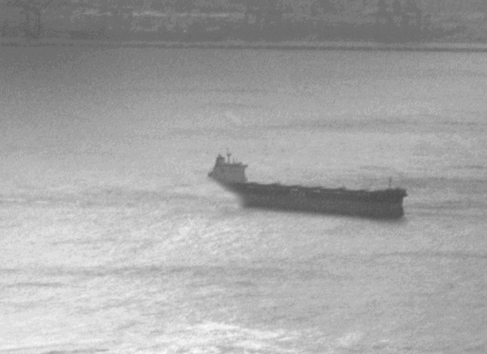 A large ship out on the open water.