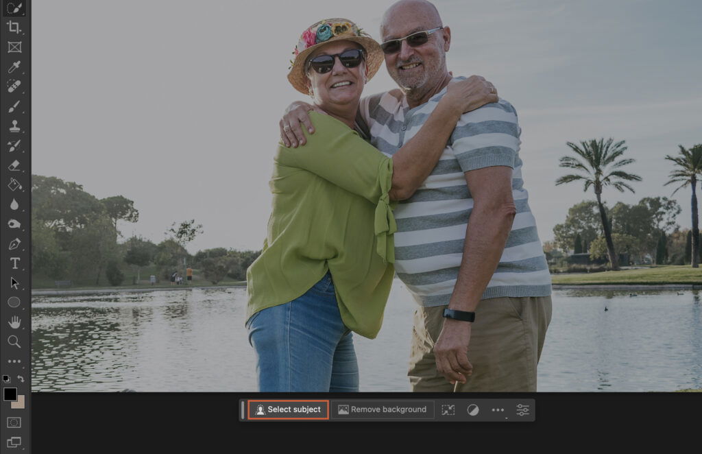 A photo editing software with two people embracing and the software interface visible.