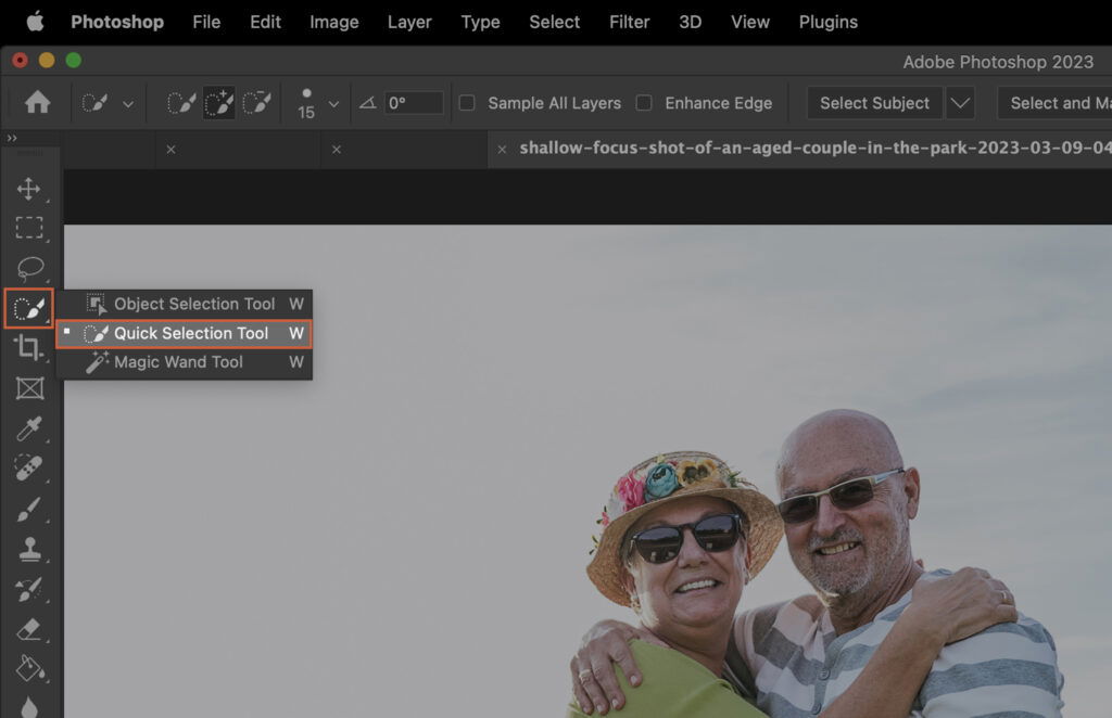 An open photo editing software, where two people are shown on the screen. 