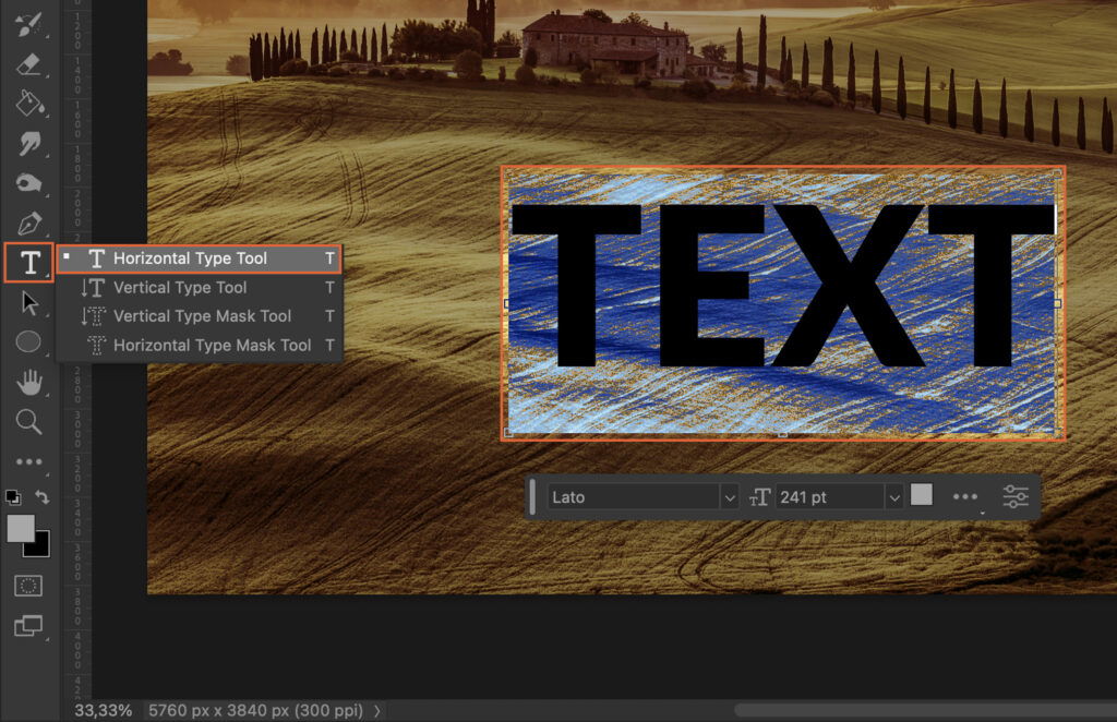 A digital artwork of a scenic landscape and a text box that says text with the text cursor highlighting it. 