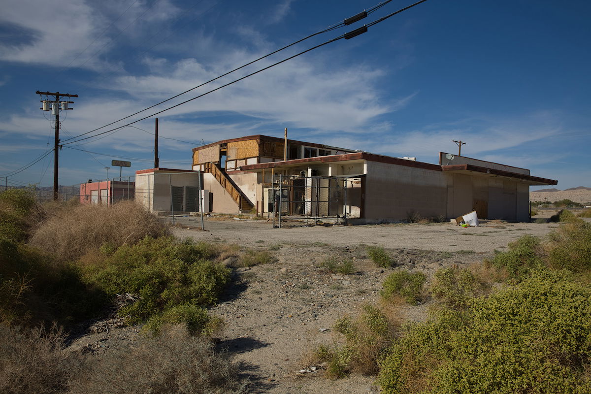 RAW image of a building in a rural area with powerlines