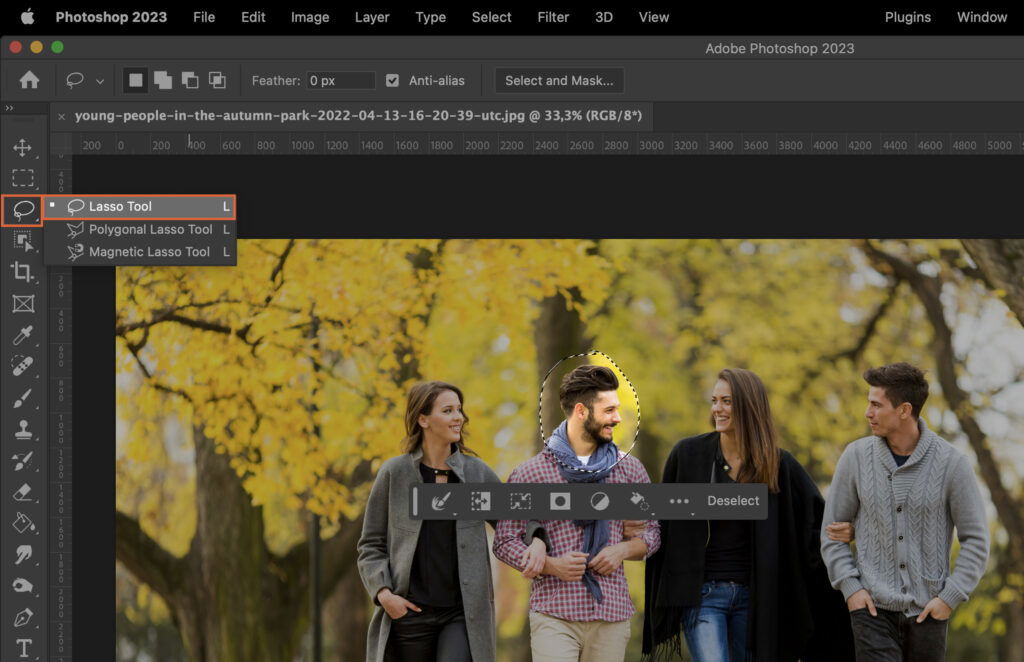 An open image editing software, featuring a photo of people and a toolbar with various selection and manipulation tools. 