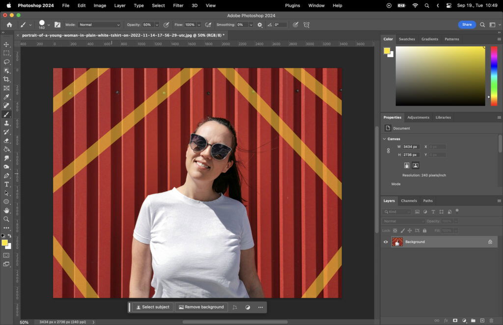 Adobe Photoshop window displaying a digital artwork featuring a woman standing in front of a red and yellow wall with her hands on her hips.