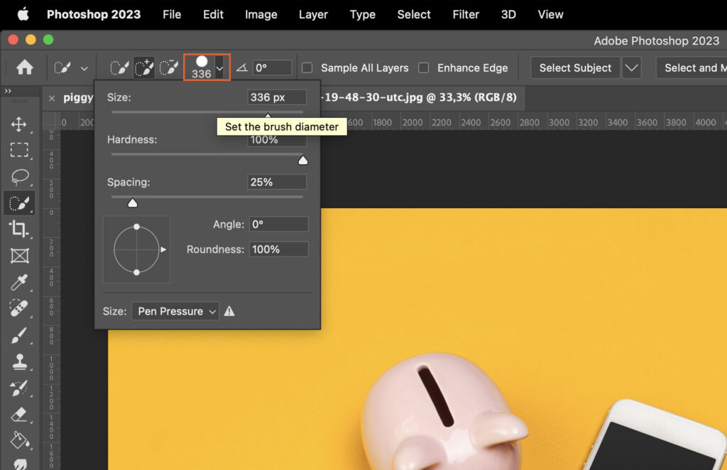 Adobe Photoshop with the user interface visible, showing a design mockup with a piggy bank on a yellow background.