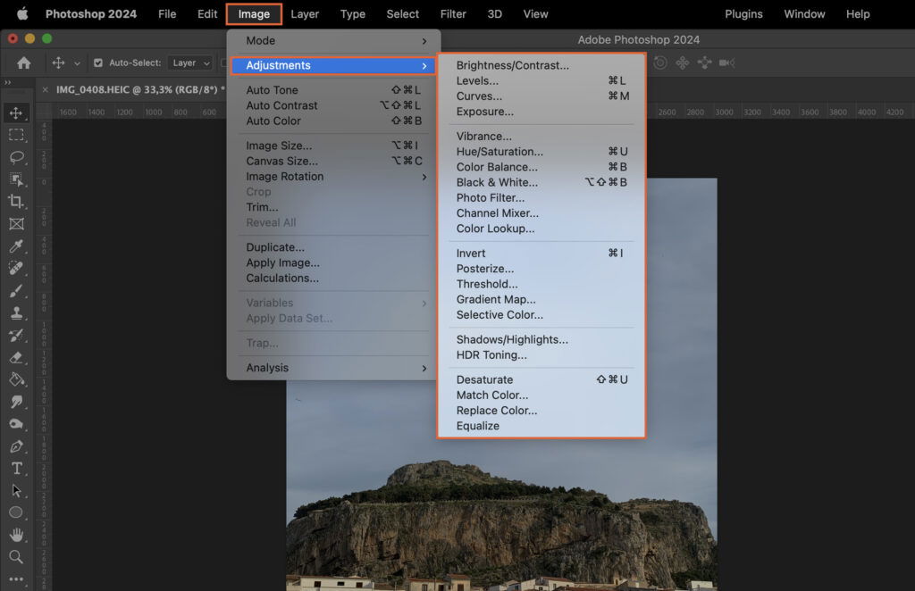 Photoshop program, displaying multiple windows and options, including a photo of a mountain. 