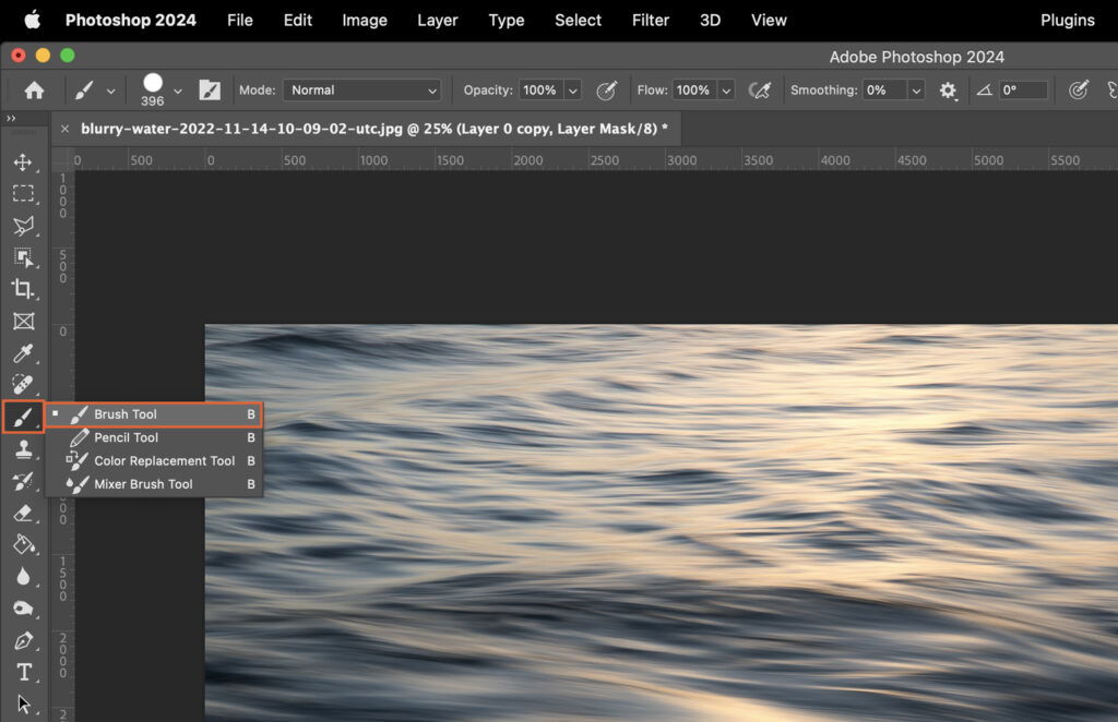 A photo editing program with the ocean as the background, showing various editing tools and interface options. 