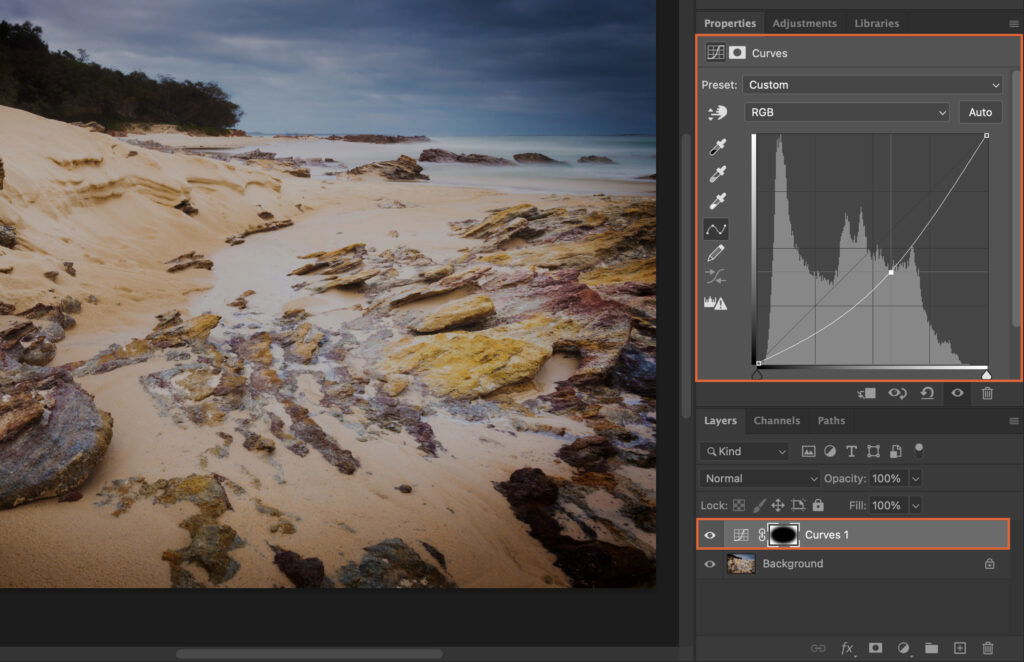 Adobe Photoshop program interface with a photo of the beach.