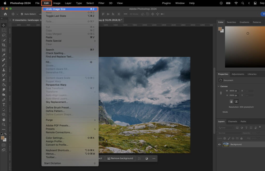 The Adobe Photoshop application with an open project window displaying multiple layers and a mountain landscape visible on one layer. 