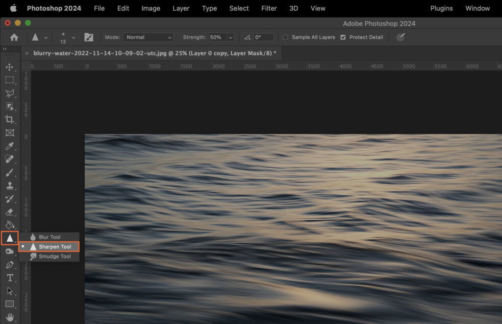 An edited photo with the water ripples effect applied, along with a dark theme user interface. 