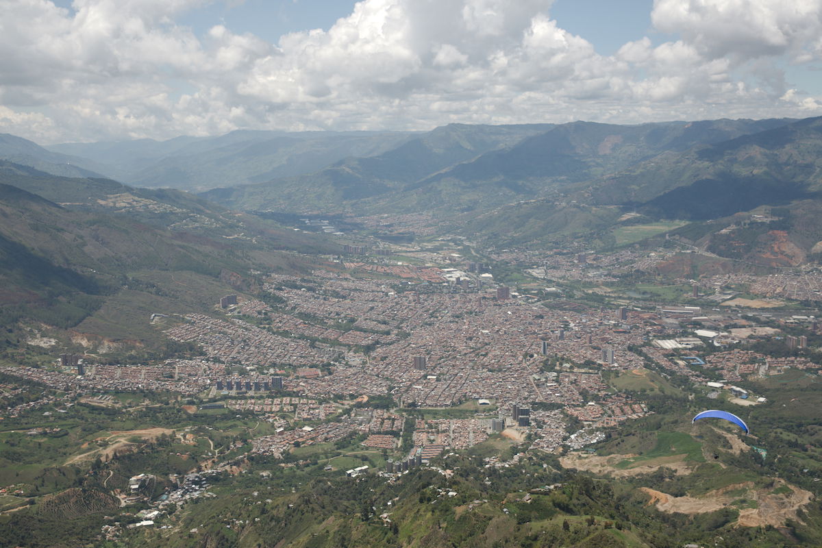 RAW landscape image with a paraglider