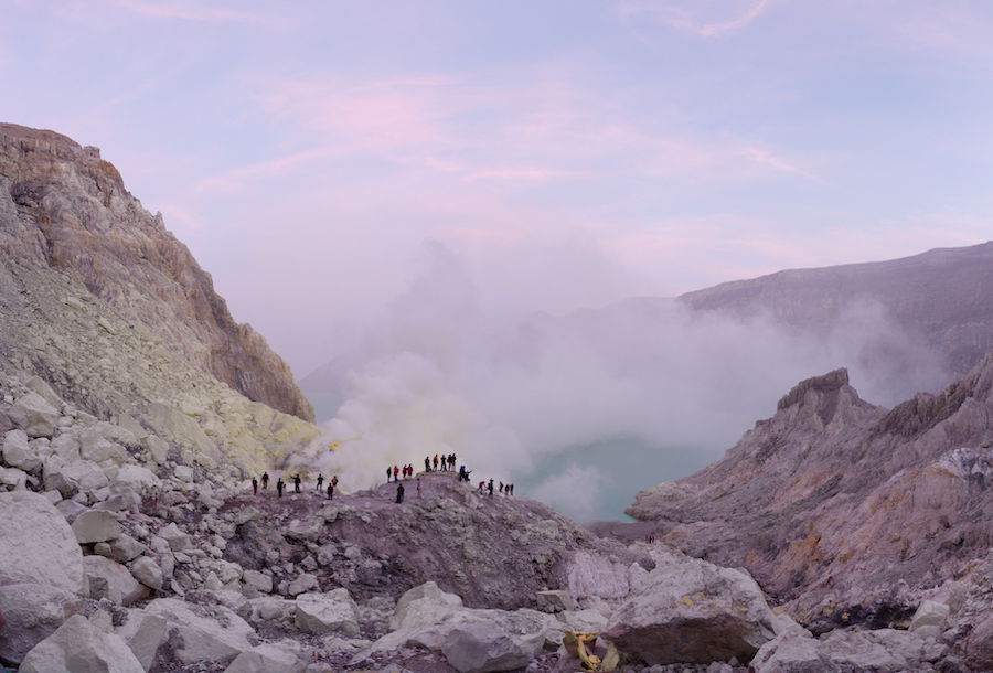 Rocky and foggy landscape image with people on a ridge