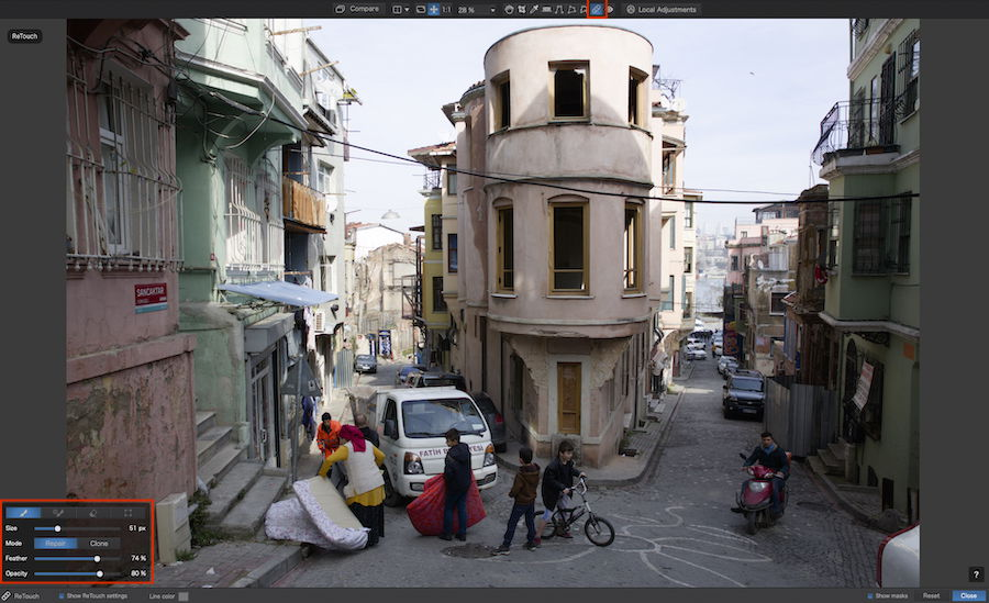 Screenshot of PhotoLab7 ReTouch tool with an image of city buildings and intersection