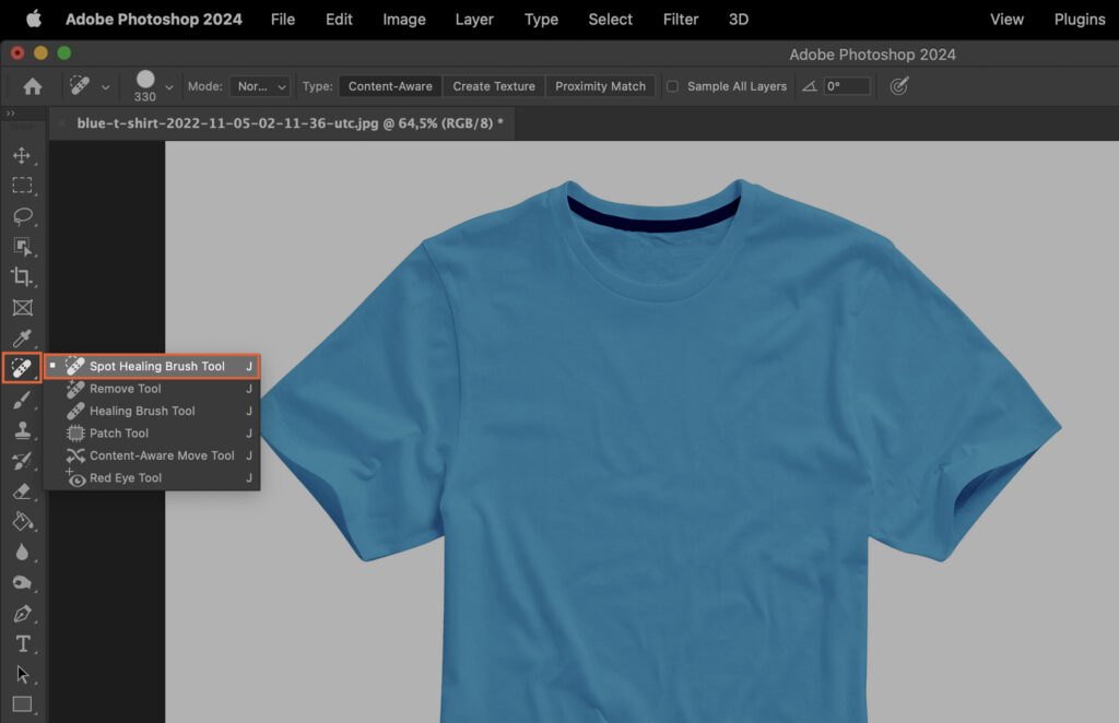 A blue t-shirt template with design tools and text, showcasing the creation process in a digital art program. 