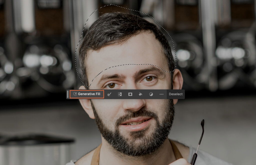 A mans face with the focus on his eyes, which are edited to be black and white while the rest of the photo is in color.