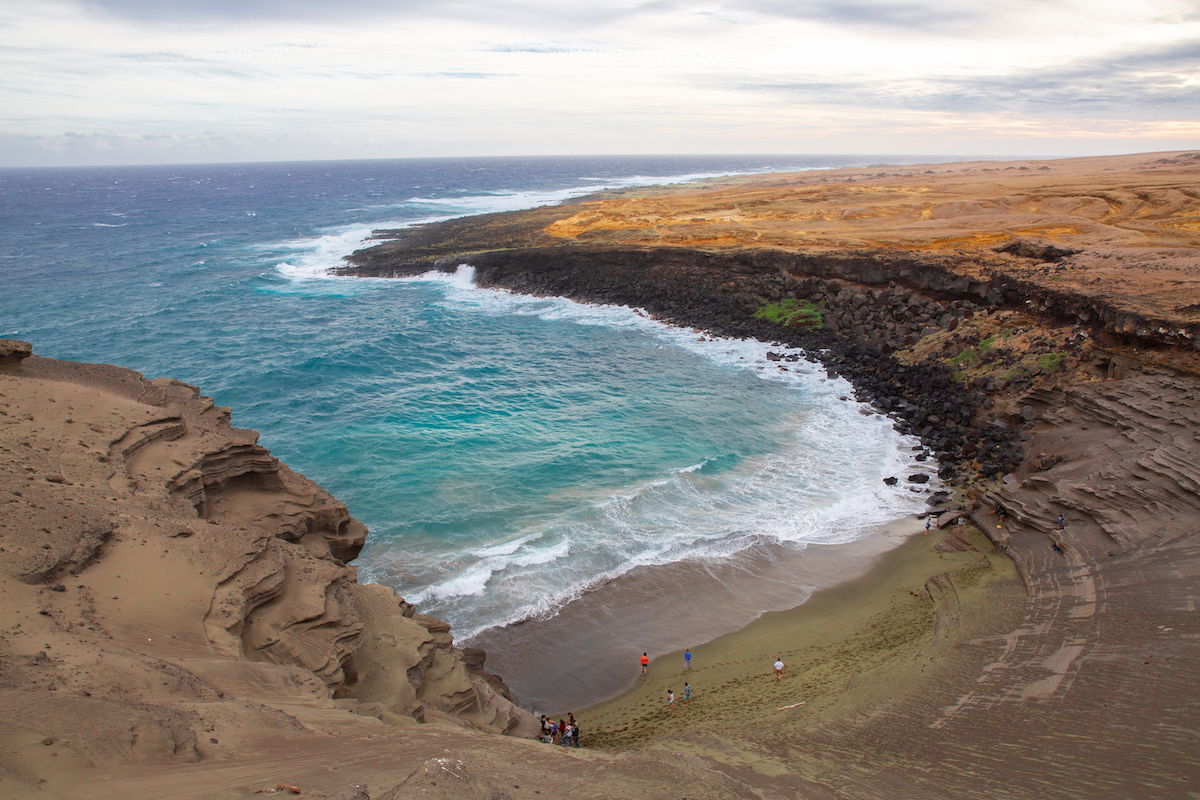 Original seascape image with people on a beach