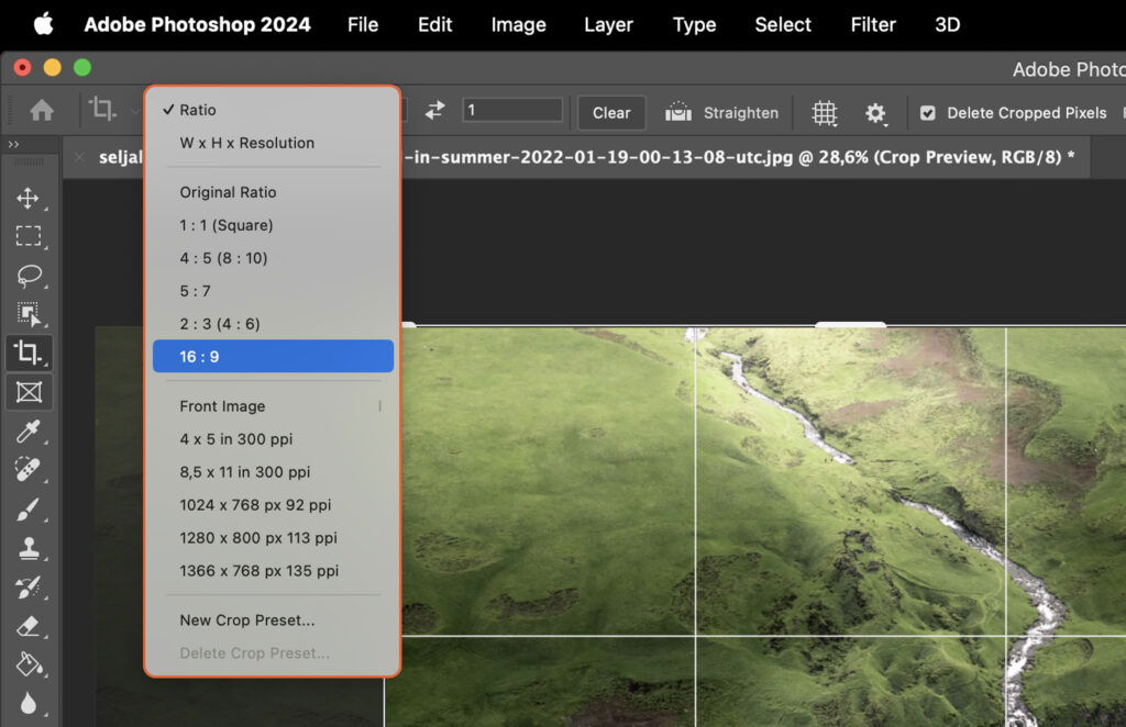 Adobe Photoshop interface with a photo of a landscape being edited.