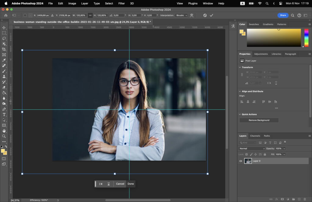 Adobe Photoshop program with a womans portrait being edited, set against the software interface. 