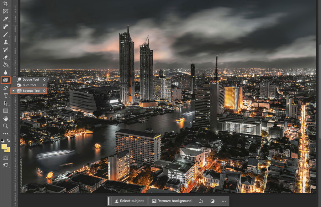 A cityscape at night, viewed from a high vantage point. 