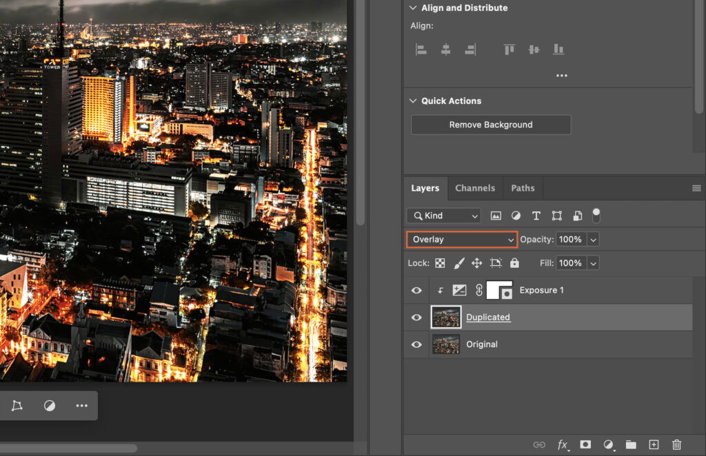 An image editing software open, showing a cityscape photograph being edited in Adobe Photoshop. 