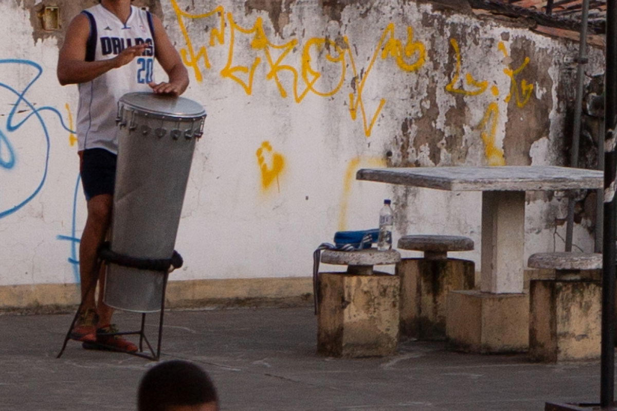 Crop of a person playing a steel drum in Adobe Lightroom