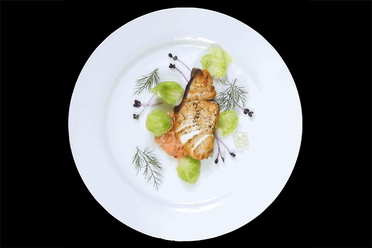 A styled overhead view of a salmon dish