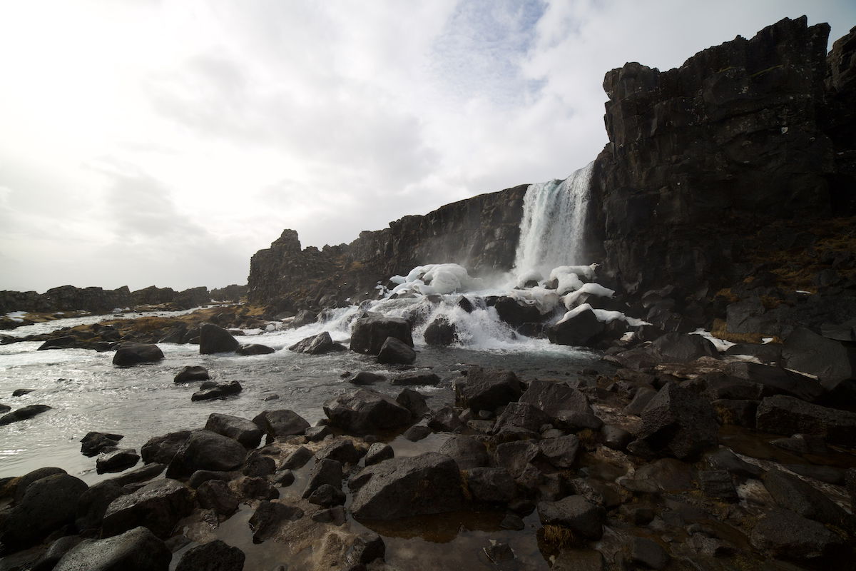 image of a waterfall in a snowy area