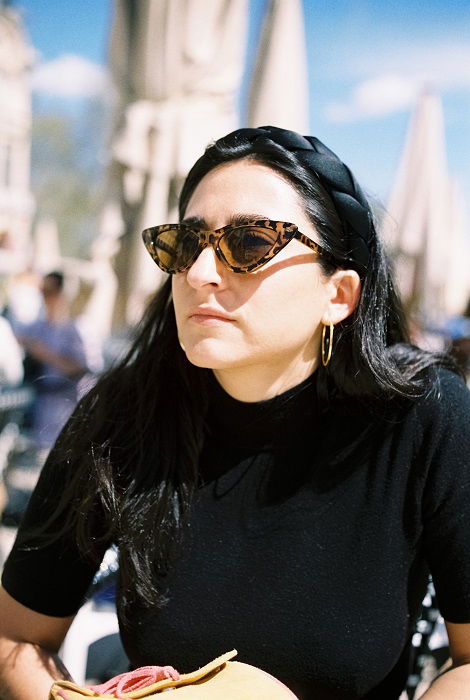 Portrait of young woman with sunglasses outside