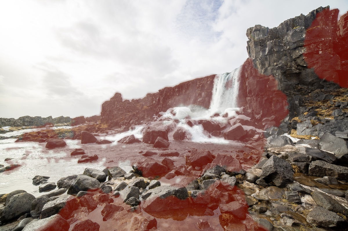 photograph of a waterfall with a deghost overlay showing high deghosting