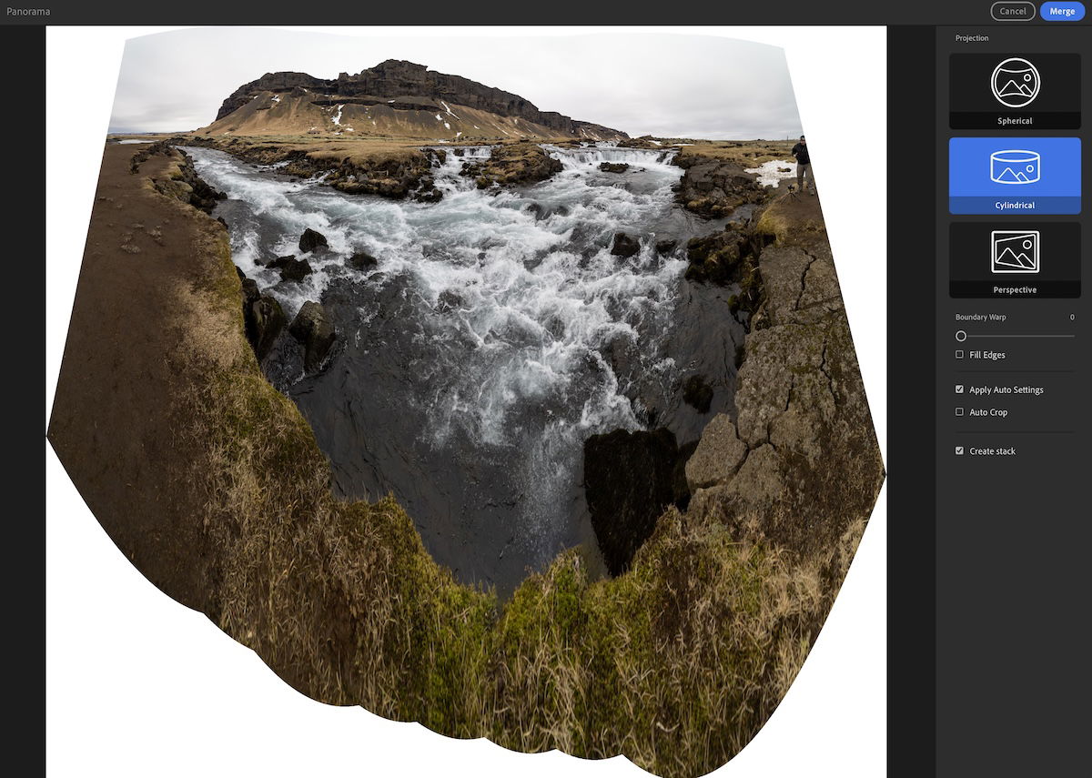 Panorama of mountains with a river in the foreground with a cylindrical stitching