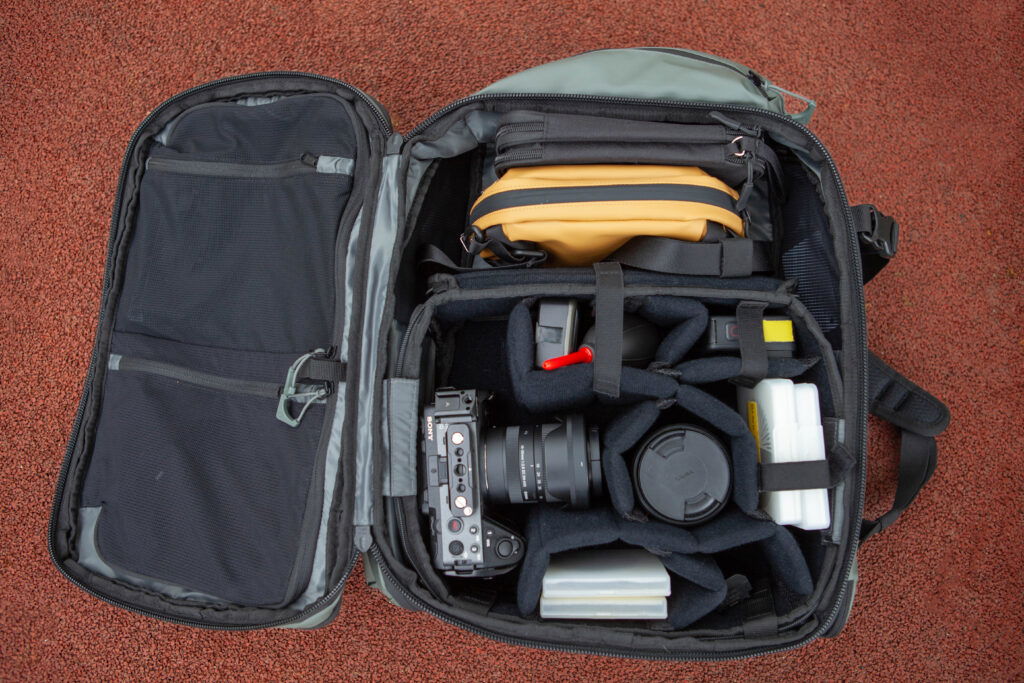 An open suitcase containing photography equipment.