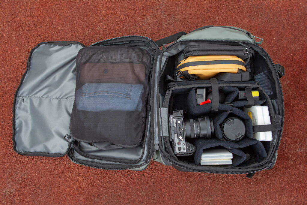 Photography equipment in a suitcase on the floor.