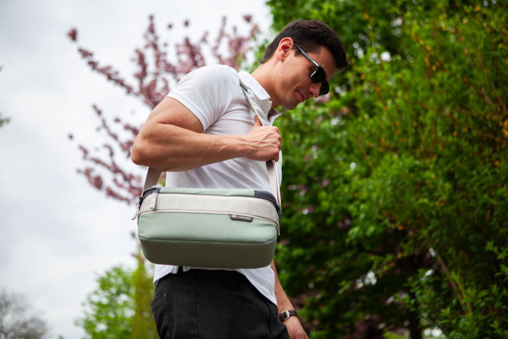 Man carrying Nomatic Luma Camera Sling 12L on his shoulder