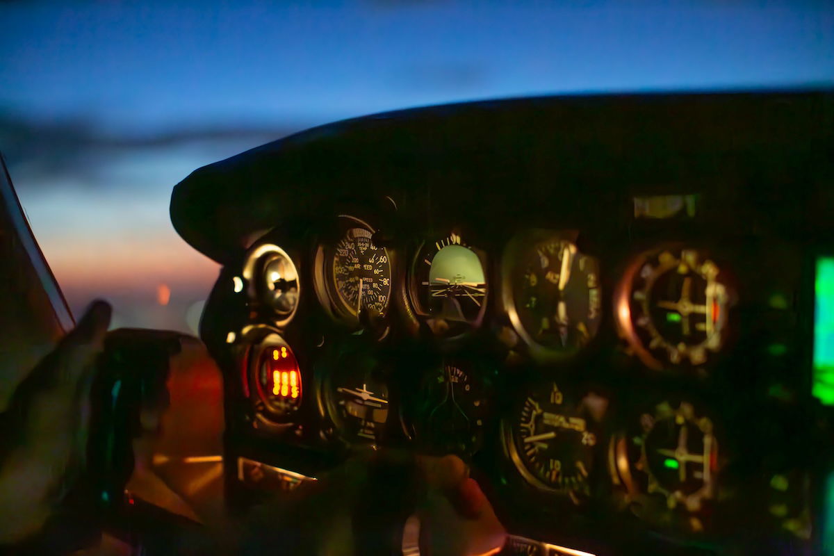 underexposed image of a cockpit at night edited in lightroom with added adjustments in the shadows