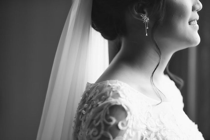 Black and white photo of woman in wedding dress