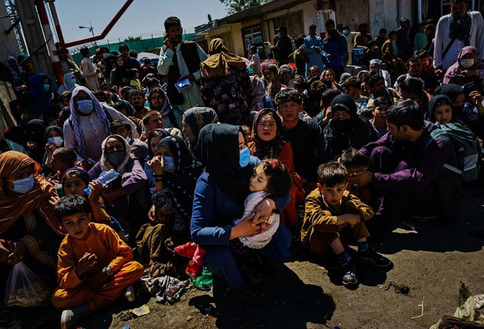 Crowd of Afghan women and children sitting together