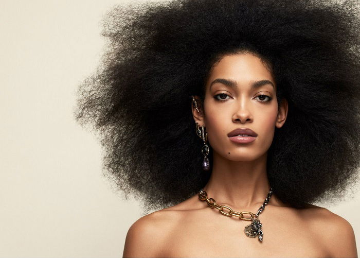 Studio portrait of woman with afro