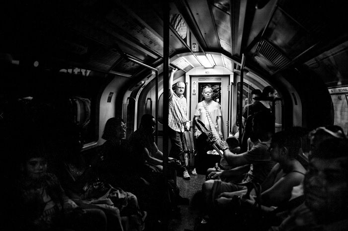 Elderly couple standing at the end of a tube carriage