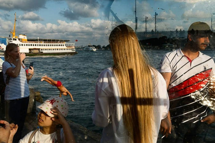 Composite image of people on a dockside