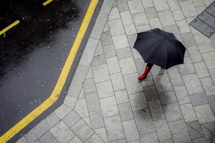 Overhead shot of person under an umbrella