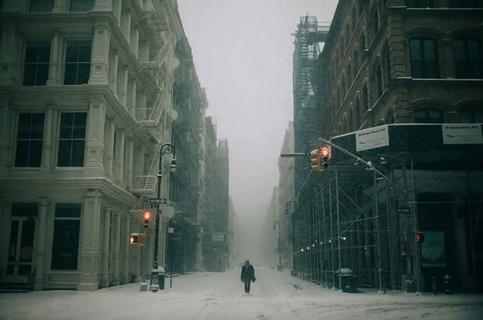 Snowy street abandoned except for one person