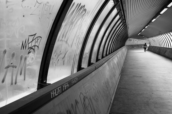 Person walking through pedestrian tunnel