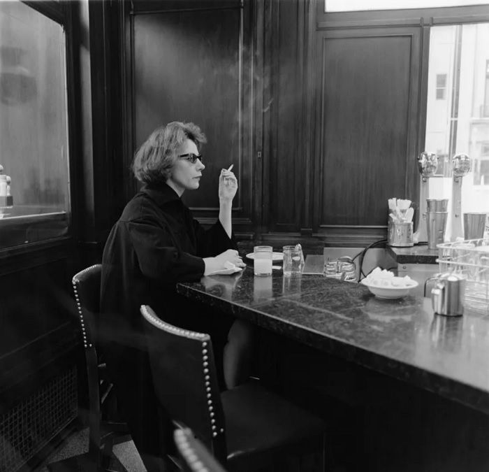 Woman smoking in a cafe