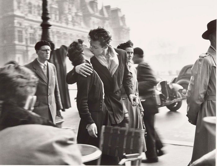 Couple kissing in busy street