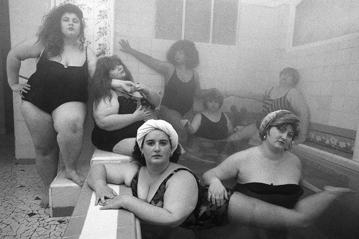 Large women in a steamy pool room