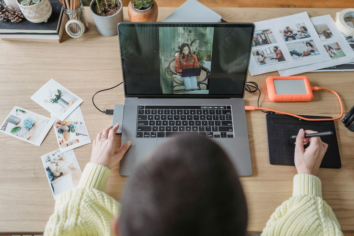 photo of person sitting at laptop photo editing