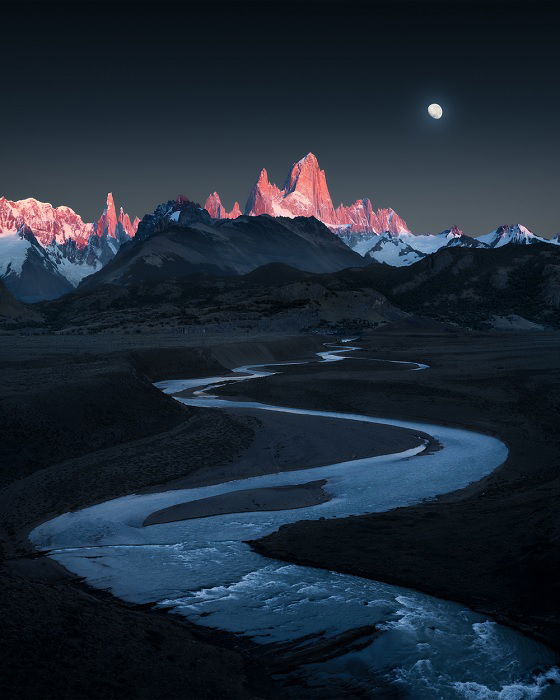 Winding river with mountains in the background