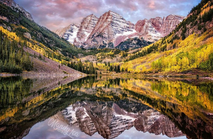 Lake with big mountains behind