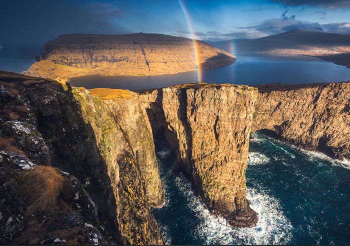 Coastal cliffs with rainbow