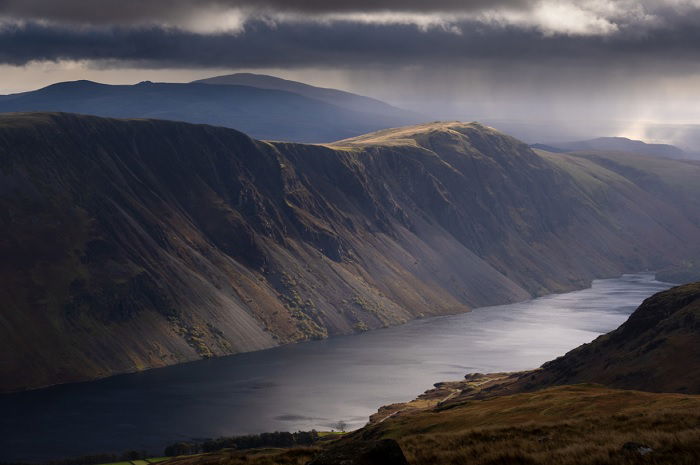 Landscape shot of a loch with mountains on either side