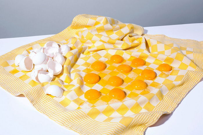 Cracked eggs in a teatowel